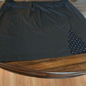 Two black skirts. One has a sequence area.The other one lace.